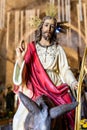 Statue of Jesus holding a wooden cross. The statue is made of wood in a holy week procession Royalty Free Stock Photo