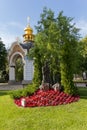 Statue of Jesus surrounded by flowers in the courtyard of the Mahaylovsky Cathedral. Kiev