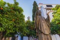 Statue of Juan Pablo II in the Virgen de los Reyes square, in front of the Giralda, in Seville, Spain