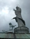 Statue of Kannon atop Temple with Children Royalty Free Stock Photo