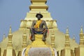 Statue of the King Chao Anouvong in front of the Pha That Luang stupa in Vientiane, Laos. Royalty Free Stock Photo