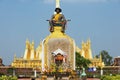 Statue of the King Chao Anouvong in front of the Pha That Luang stupa in Vientiane, Laos. Royalty Free Stock Photo
