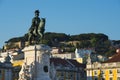 The Statue of the King Dom Jose in the Commerce Square Praca do Comercio with the Saint George Castle Castelo de Sao Jorge in Royalty Free Stock Photo