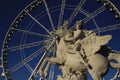 Statue of King of Fame riding Pegasus on the Place de la Concorde with ferris wheel at background, Paris, France Royalty Free Stock Photo