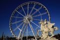 Statue of King of Fame riding Pegasus on the Place de la Concorde with ferris wheel at background, Paris, France Royalty Free Stock Photo