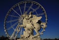 Statue of King of Fame riding Pegasus on the Place de la Concorde with ferris wheel, Paris, France Royalty Free Stock Photo