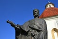 Statue of King Louis I of Hungary with letters of city privileges of Skalica city in his right hand, in front of gothic Charnel