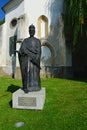 Statue of King Louis I of Hungary with letters of city privileges of Skalica city in his right hand, in front of gothic charnel