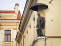 Statue of a Knight - The City Gatekeeper - on a house in Vilnius Old Town.