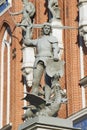 Statue of the knight defeating a dragon in front of the House of Blackheads in Riga, Latvia. Royalty Free Stock Photo