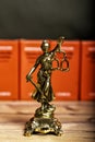statue of Lady Justice, goddess Justitia, on the desk in a lawyer\'s office Royalty Free Stock Photo