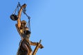 Statue of Lady Justice with scales of justice. Legal law concept. On a sky background Royalty Free Stock Photo