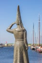 Statue of a lady looking out over sea in Stavoren