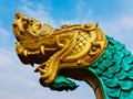 Statue of a large serpent in golden head and green body