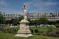 Statue on the lawn in jardin des tuileries Royalty Free Stock Photo