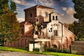 Statue of Lazarillo de Tormes leading the blind man in the background of the Iglesia de Santiago in Salamanca Spain