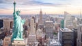 The Statue of Liberty with aerial view of Manhattan skyline background, skyscraper in New York City at sunset in evening