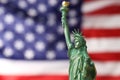 Statue of Liberty against flag of USA, closeup. Space for text Royalty Free Stock Photo
