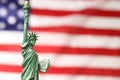 Statue of Liberty against flag of USA, closeup. Space for text Royalty Free Stock Photo