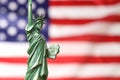 Statue of Liberty against flag of USA, closeup. Space for text Royalty Free Stock Photo