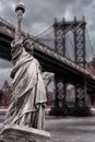 Statue of Liberty against Manhattan Bridge at night, Cityscape of New York City Royalty Free Stock Photo