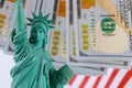 Statue of Liberty on the background money american hundred dollar bills Royalty Free Stock Photo