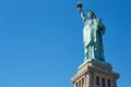 Statue of Liberty on blue sky, low angle view Royalty Free Stock Photo