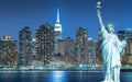 The Statue of Liberty with cityscape in Manhattan at night, New York City Royalty Free Stock Photo