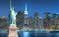 The Statue of Liberty with cityscape in Manhattan at night, New York City Royalty Free Stock Photo