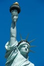 Statue Of Liberty Detail With Golden Torch, Blue Sky In New York