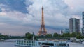 The Statue of Liberty and the Eiffel Tower day to night Timelapse with modern buildings. Paris, France Royalty Free Stock Photo