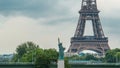 The Statue of Liberty and the Eiffel Tower Timelapse. Paris, France Royalty Free Stock Photo