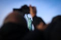 The Statue of Liberty framed by a tourist. Royalty Free Stock Photo