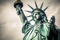 Statue of liberty low angle view in cloudy day. Royalty Free Stock Photo