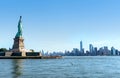 Statue Of Liberty With Manhattan Skyline In New York. Panorama View To The Downtown Of NYC. Tourists Sightseeing In Liberty Island