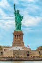 Statue of Liberty on Liberty Island, New York City. Cloudy Blue Sky Background, Vertical Banner Royalty Free Stock Photo