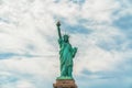 Statue Of Liberty, New York City Against Cloudy Blue Sky Royalty Free Stock Photo