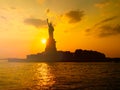 The Statue of Liberty in New York City at sunset Royalty Free Stock Photo