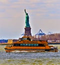 Statue of Liberty with New York City water taxi Royalty Free Stock Photo