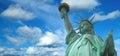 Statue of Liberty panorama with bright blue cloudy sky, New York Royalty Free Stock Photo