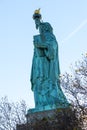 Statue of liberty profile low angle view against blue sky Royalty Free Stock Photo