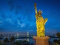 Statue of Liberty and Rainbow bridge, located at Odaiba Tokyo, w Royalty Free Stock Photo