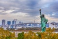 Statue of Liberty and Rainbow Bridge on Odaiba Island in Tokyo, Japan. With Tokyo Tower on Background Royalty Free Stock Photo