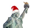 Statue of Liberty with Santa Claus hat isolated on white background. Graphic resource. Royalty Free Stock Photo