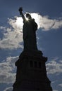 Statue of Liberty Silhouette and sun. Royalty Free Stock Photo