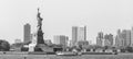 Statue of Liberty with Liberty State Park and Jersey City skyscrapers in background, USA