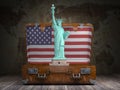 Statue of liberty and vintage suitcase with flag of USA. Travel and tourism to NY New York city and USA concept Royalty Free Stock Photo