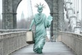 the statue of liberty walking across a bridge, AI generated Royalty Free Stock Photo
