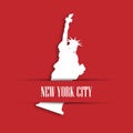 Statue of Liberty white paper cutting in red greeting card pocket with label New York City. United States symbol and