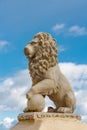 Statue of a lion against a blue sky Royalty Free Stock Photo